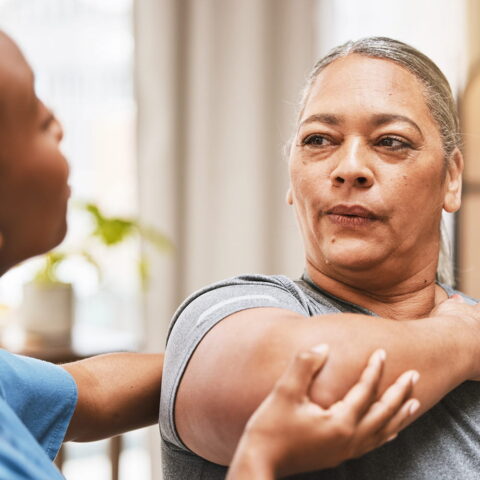 woman with physical therapist