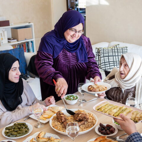 Three women eating a meal at a table